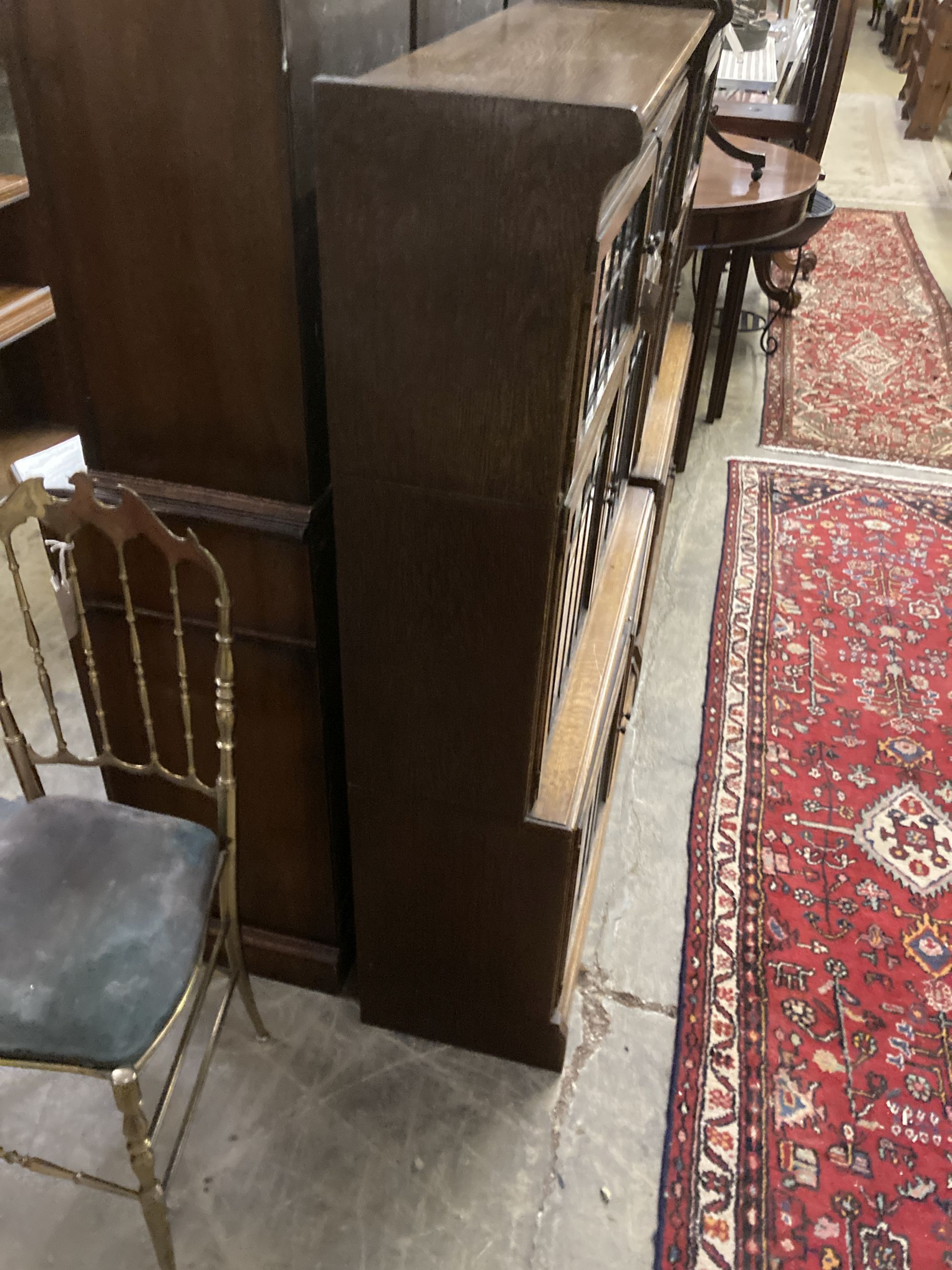 A pair of Globe Wernicke style oak three section leaded glazed bookcases, length 89cm, depth 33cm, height 129cm